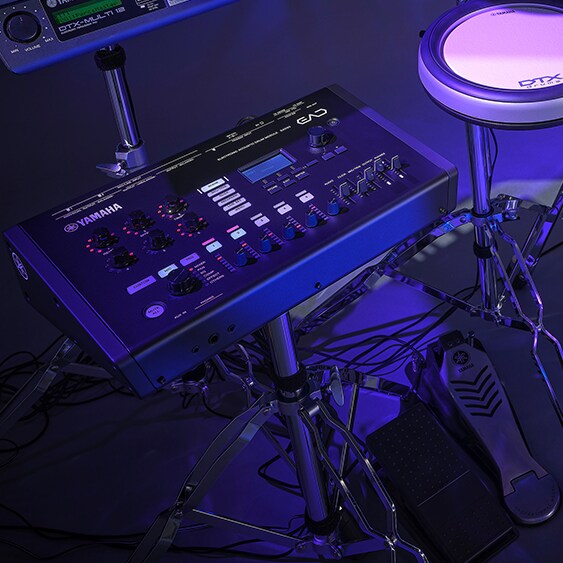 A EAD50 electronic drum module, connected to a Yamaha DTX drum kit, in purple stage lighting