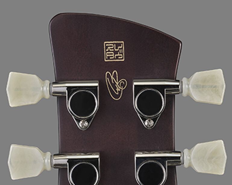 Signature engraving on the back of the headstock of the Signature Revstar RS02CB