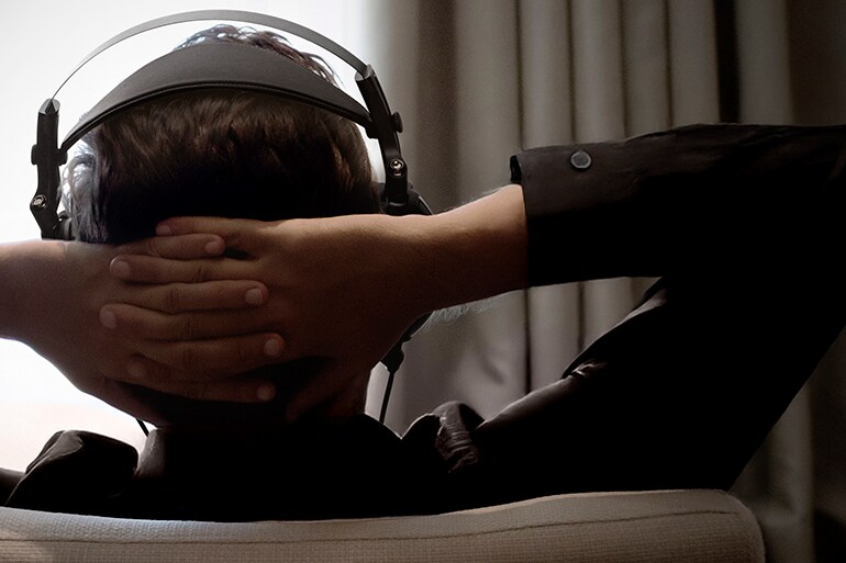 Image of a person listening to YH-C3000 headphones