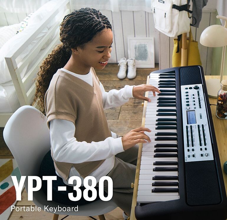A girl playing the YPT-380