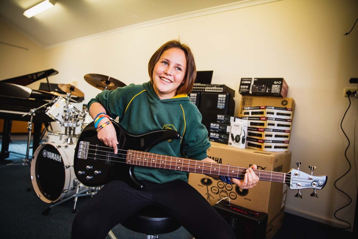 Student with Yamaha Bass Guitar